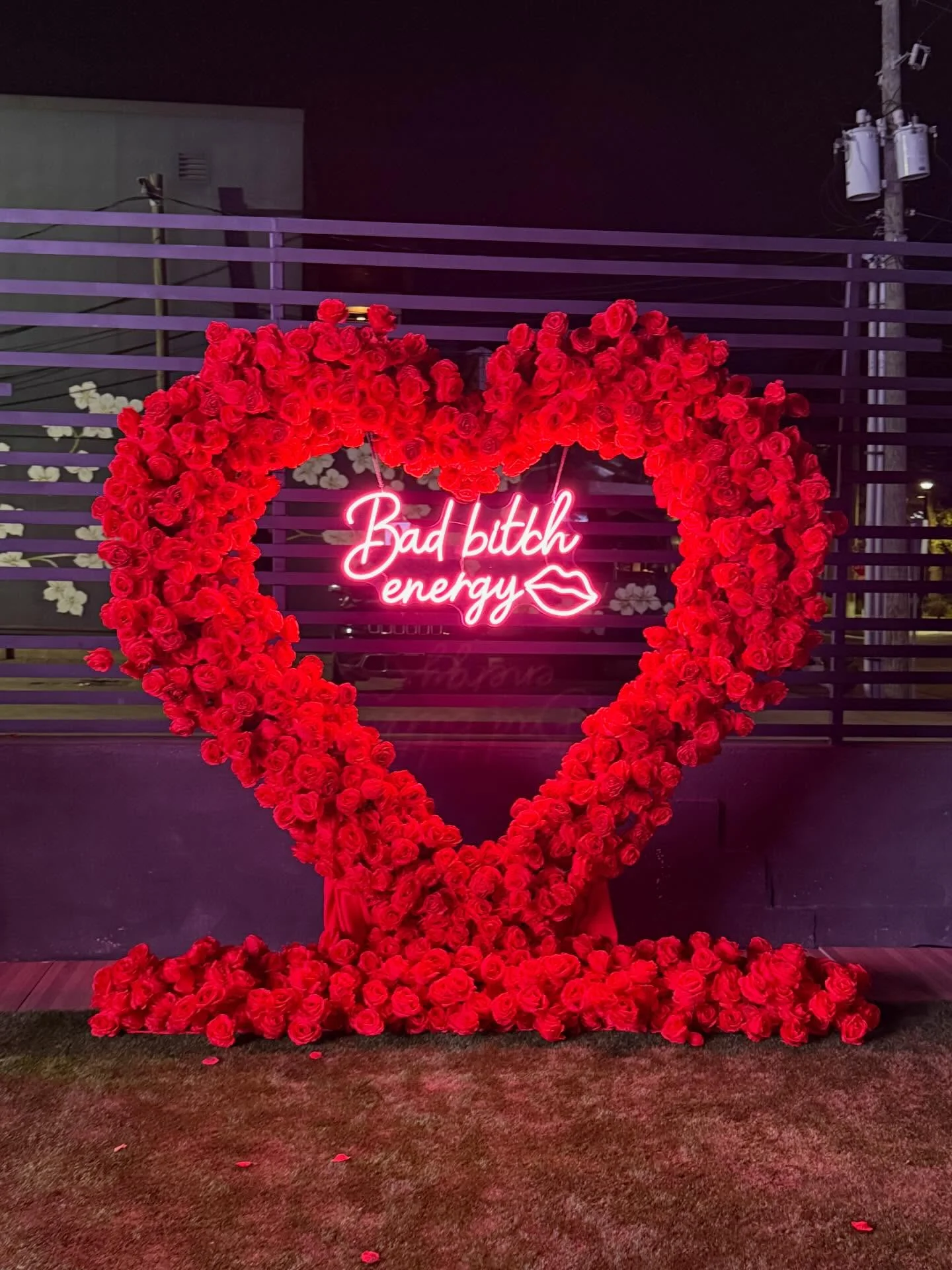 The 'bad bitch energy' neon rose heart on the Styx + Stone rooftop