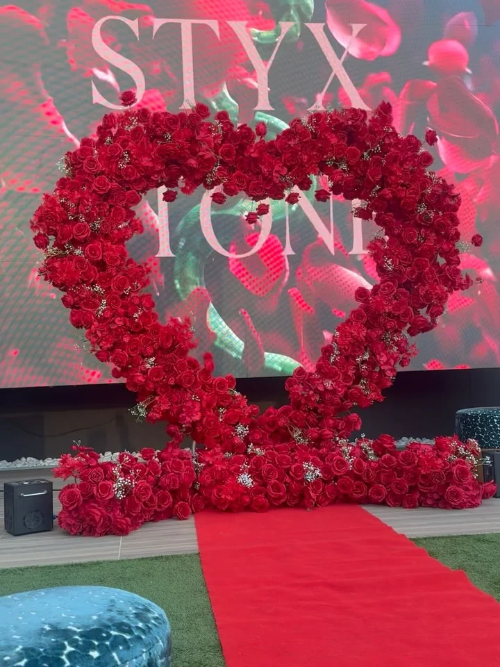 Branded rose-heart installation on the red carpet at a Styx + Stone event