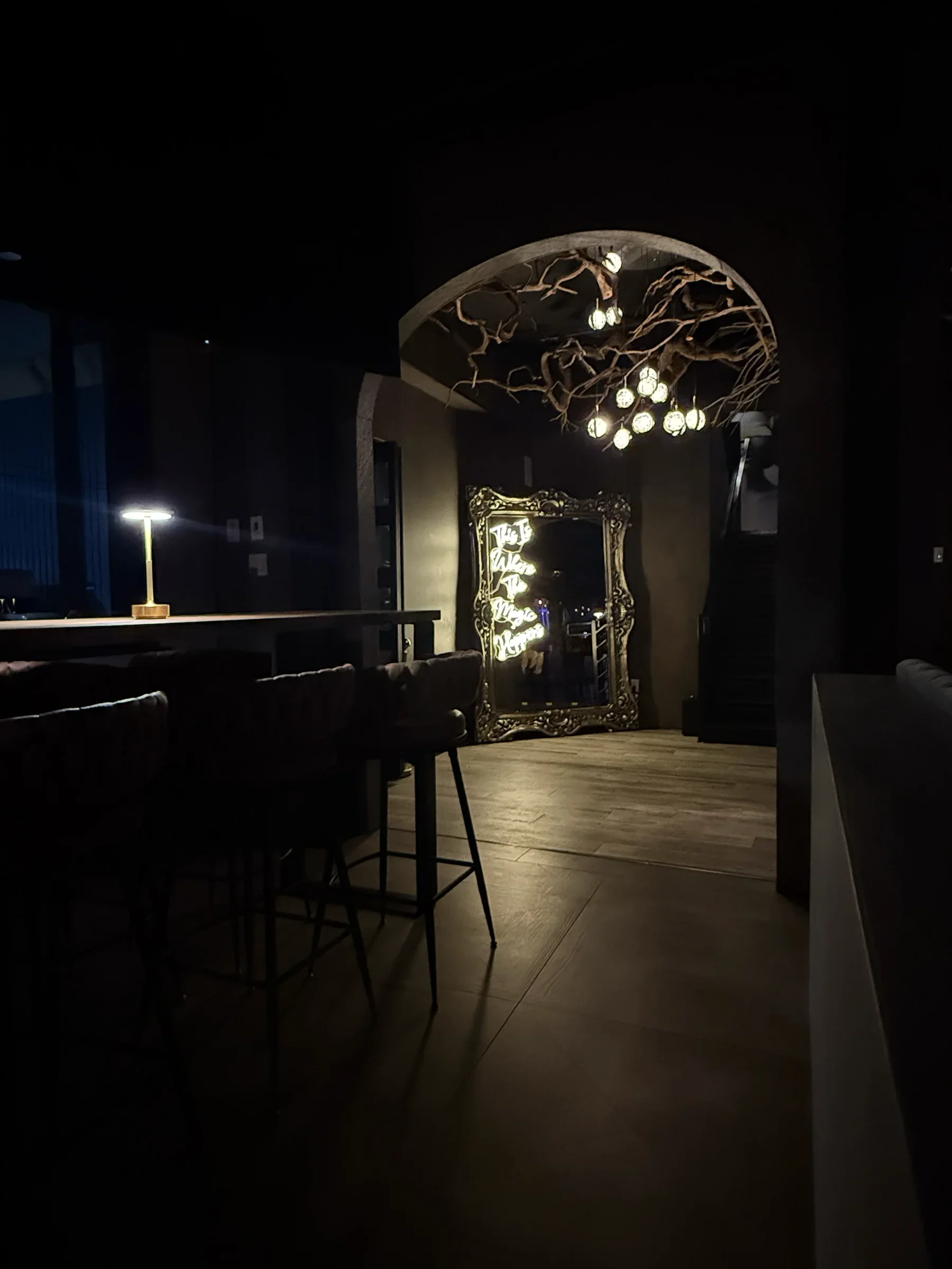A moody nook with an ornate mirror in the ground-floor bar at Styx + Stone