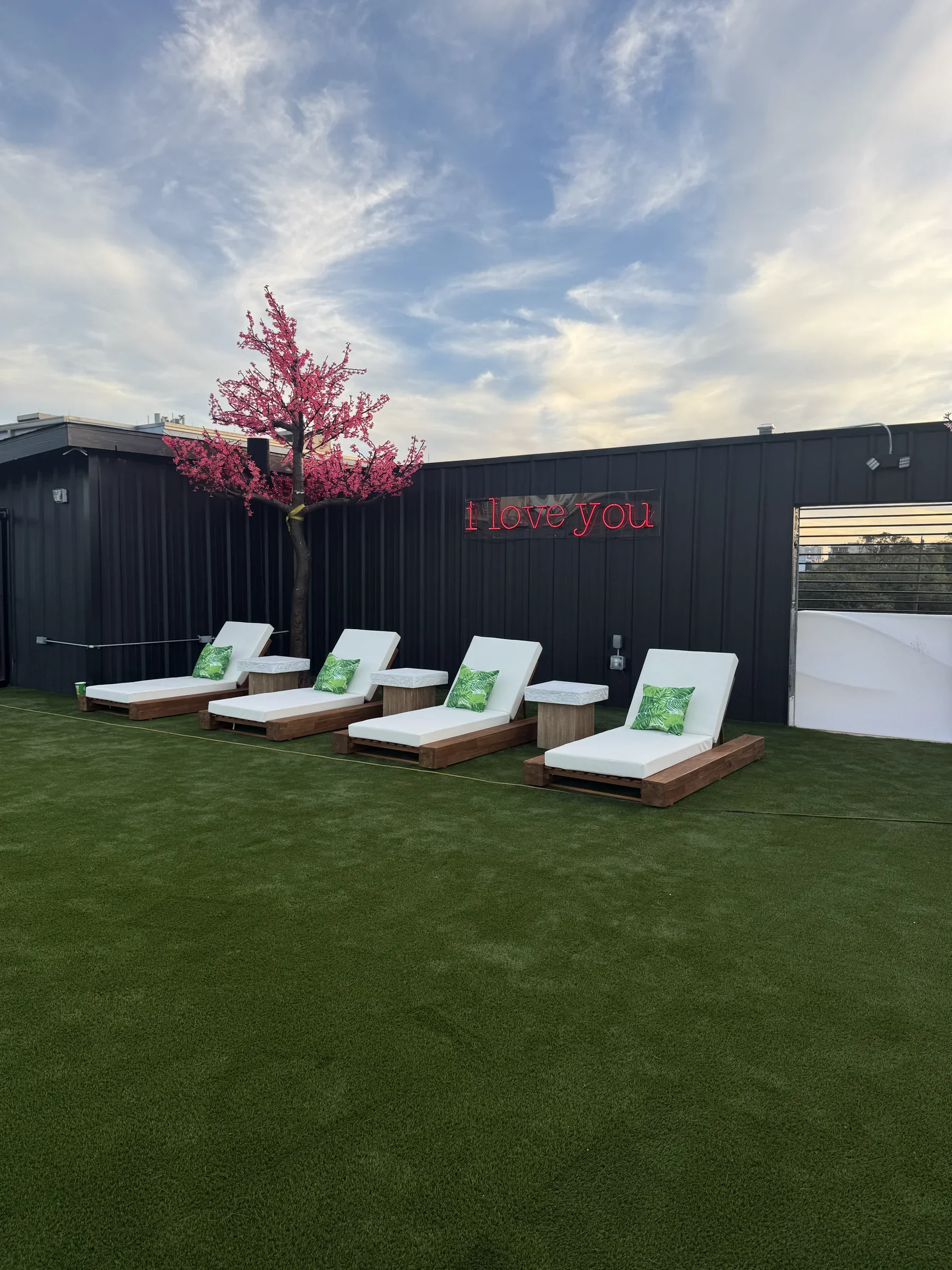 Daytime loungers on the turf of the Styx + Stone rooftop