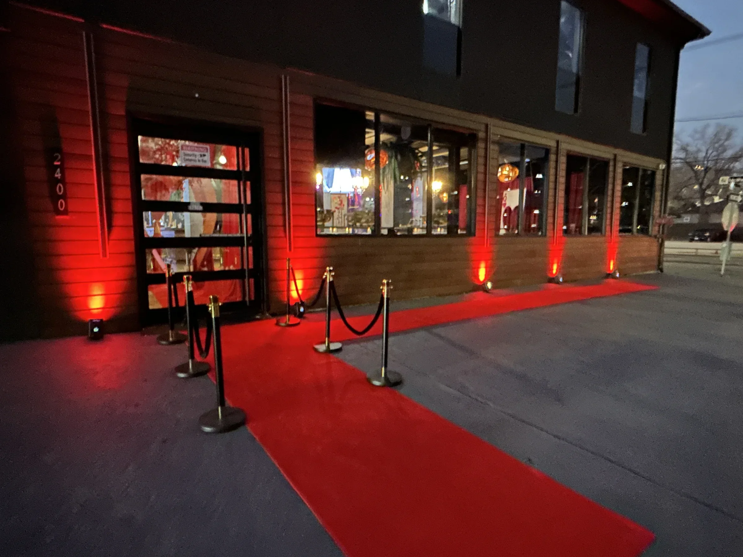 Red carpet and velvet ropes at the Styx + Stone entrance